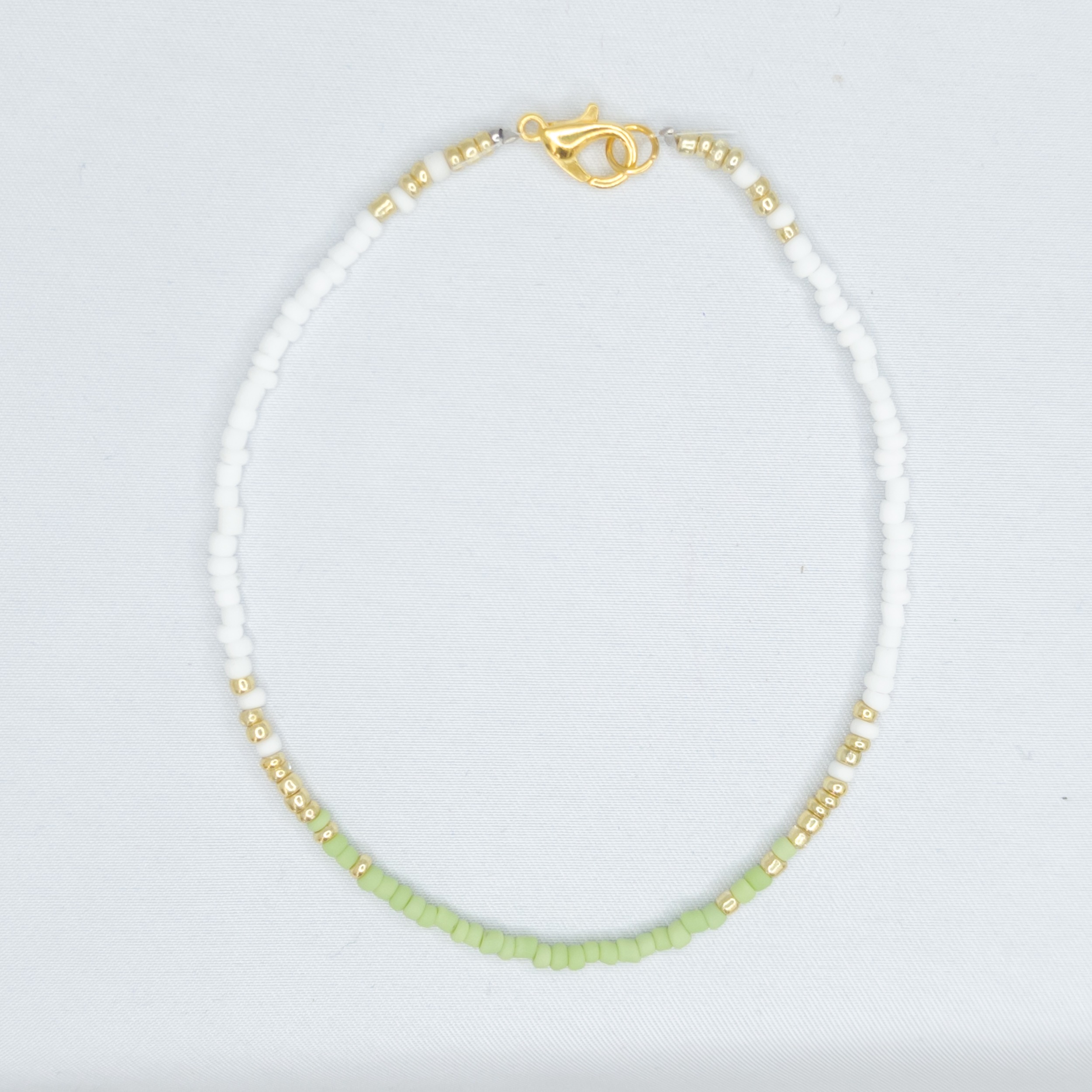 Armbandje groen/goud